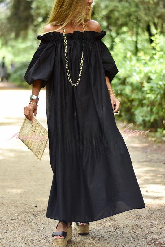 Yna|Wide maxi dress with puff sleeves under the beach promenade